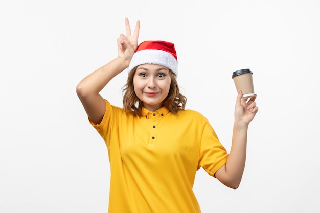 Close up on young pretty woman wearing Christmas hat isolated