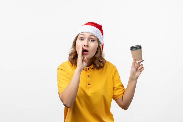 Close up on young pretty woman wearing Christmas hat isolated