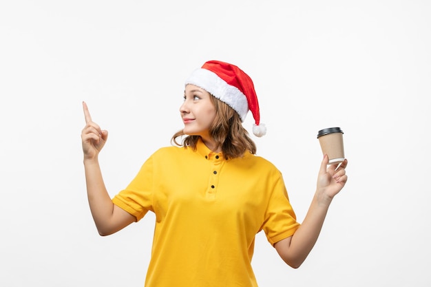 Close up on young pretty woman wearing Christmas hat isolated