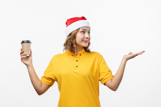 Close up on young pretty woman wearing Christmas hat isolated