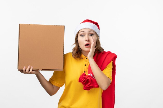 Close up on young pretty woman wearing Christmas hat isolated