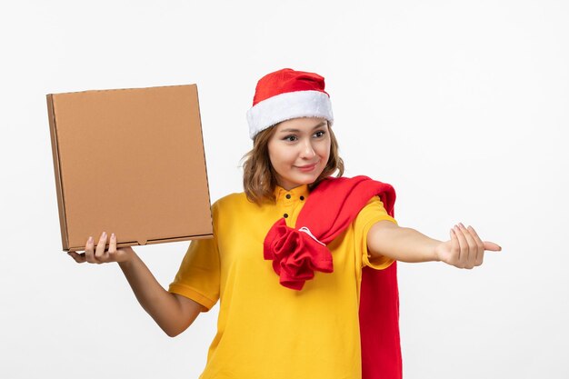 Close up on young pretty woman wearing Christmas hat isolated