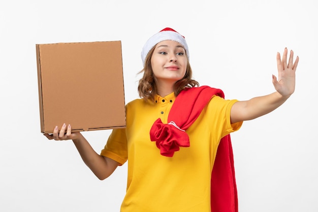 Close up on young pretty woman wearing Christmas hat isolated