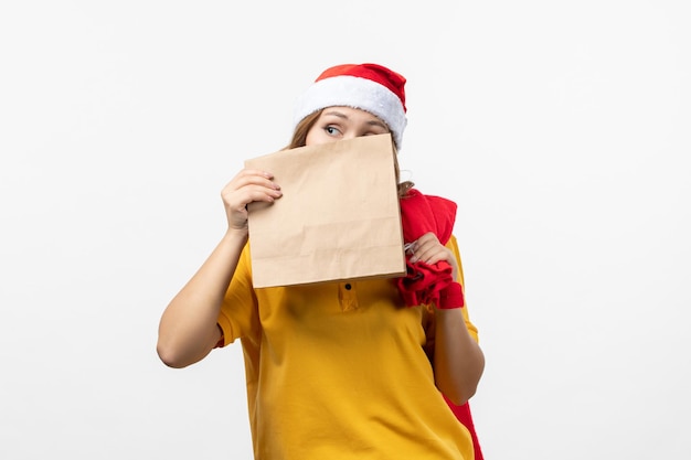 Close up on young pretty woman wearing Christmas hat isolated