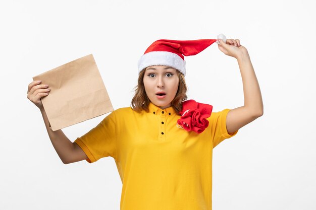 Close up on young pretty woman wearing Christmas hat isolated