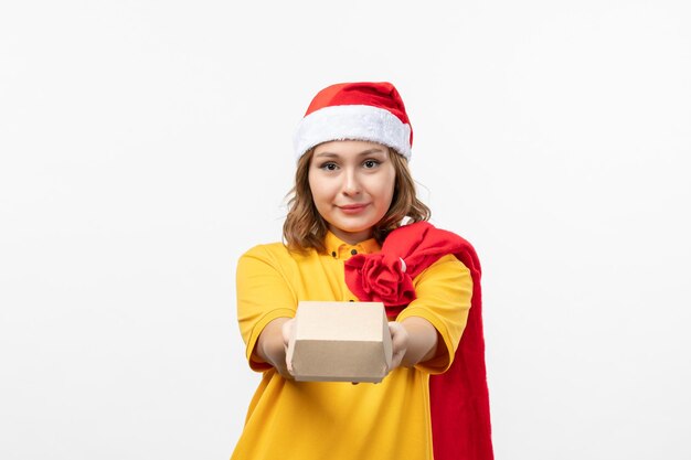 Close up on young pretty woman wearing Christmas hat isolated