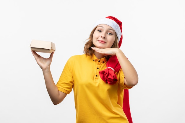 Close up on young pretty woman wearing Christmas hat isolated