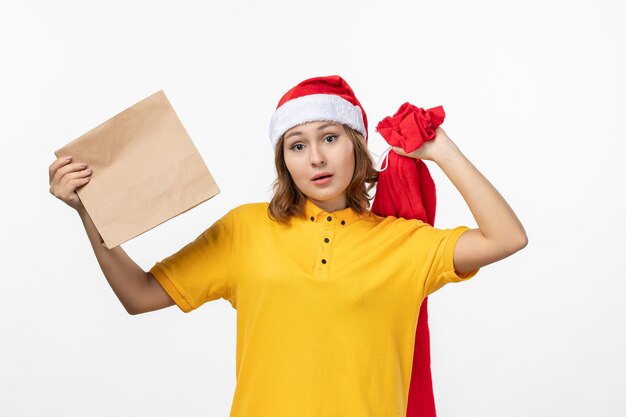 Close up on young pretty woman wearing Christmas hat isolated