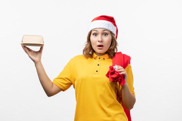 Close up on young pretty woman wearing Christmas hat isolated