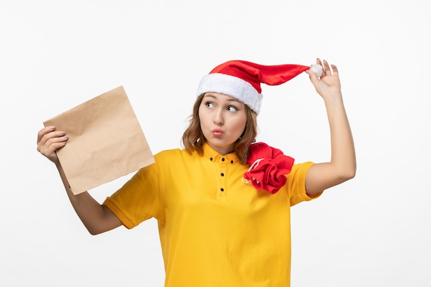 Close up on young pretty woman wearing Christmas hat isolated