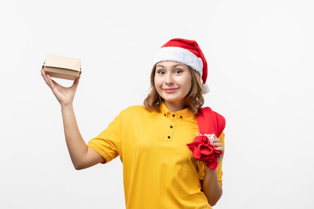 Close up on young pretty woman wearing Christmas hat isolated