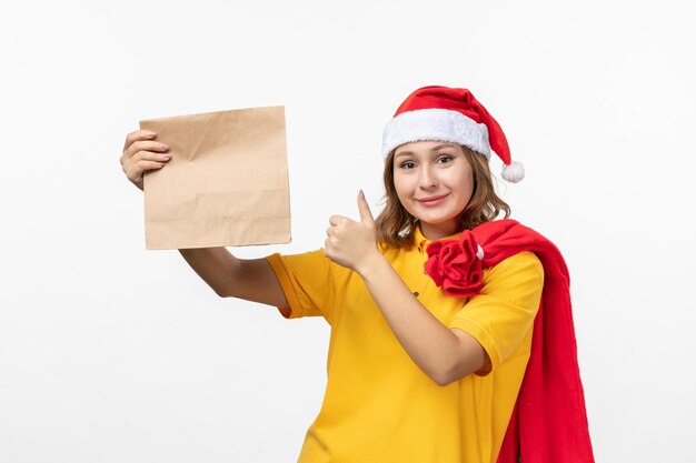 Close up on young pretty woman wearing Christmas hat isolated