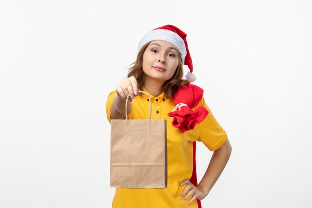 Close up on young pretty woman wearing Christmas hat isolated