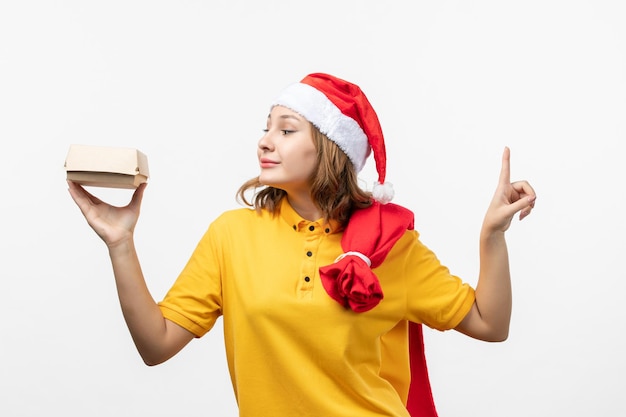 Close up on young pretty woman wearing Christmas hat isolated