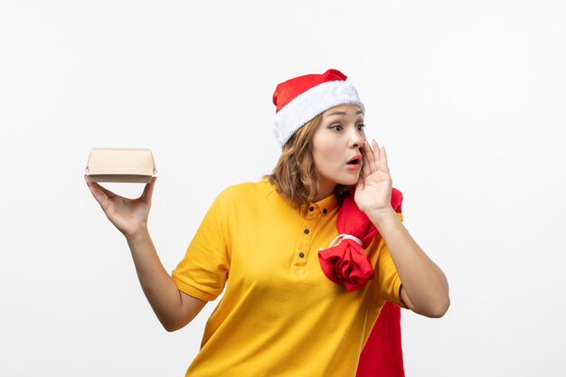 Close up on young pretty woman wearing Christmas hat isolated