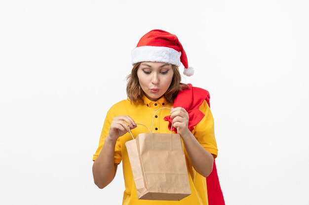 Close up on young pretty woman wearing Christmas hat isolated