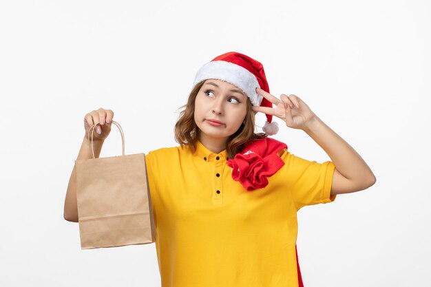 Close up on young pretty woman wearing Christmas hat isolated