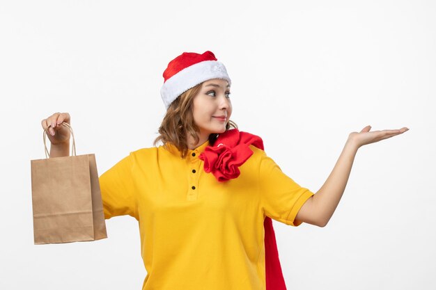 Close up on young pretty woman wearing Christmas hat isolated