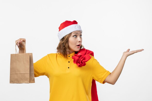 Close up on young pretty woman wearing Christmas hat isolated