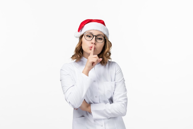 Close up on young pretty woman wearing Christmas hat isolated