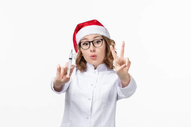 Close up on young pretty woman wearing Christmas hat isolated