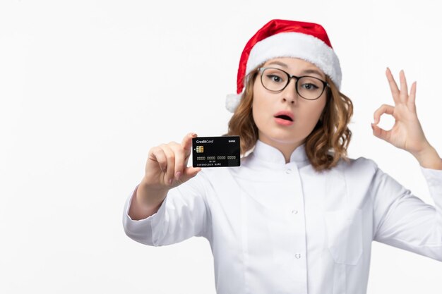 Close up on young pretty woman wearing Christmas hat isolated