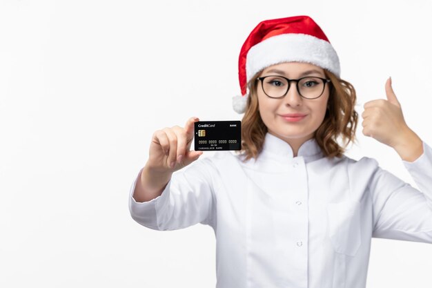 Close up on young pretty woman wearing Christmas hat isolated