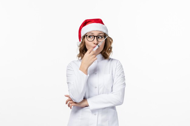 Close up on young pretty woman wearing Christmas hat isolated