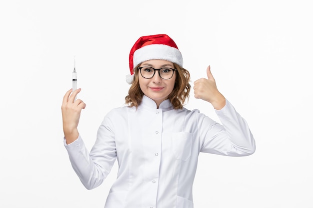 Close up on young pretty woman wearing Christmas hat isolated