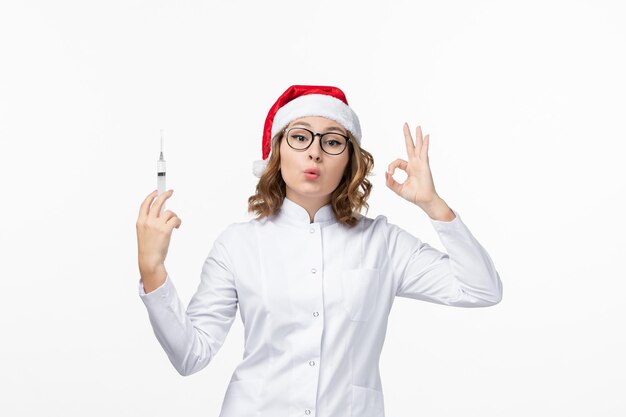 Close up on young pretty woman wearing Christmas hat isolated