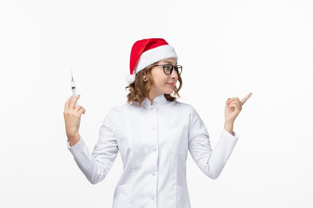 Close up on young pretty woman wearing Christmas hat isolated