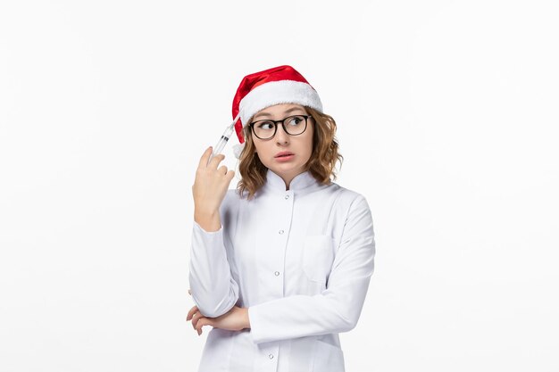 Close up on young pretty woman wearing Christmas hat isolated