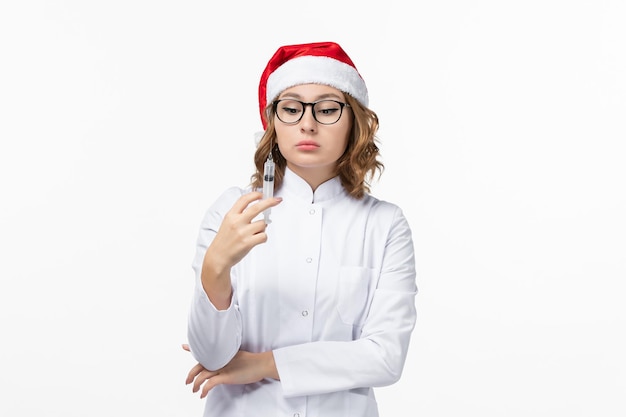 Close up on young pretty woman wearing Christmas hat isolated