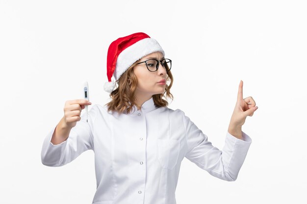 Close up on young pretty woman wearing Christmas hat isolated