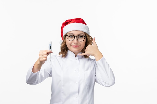 Close up on young pretty woman wearing Christmas hat isolated