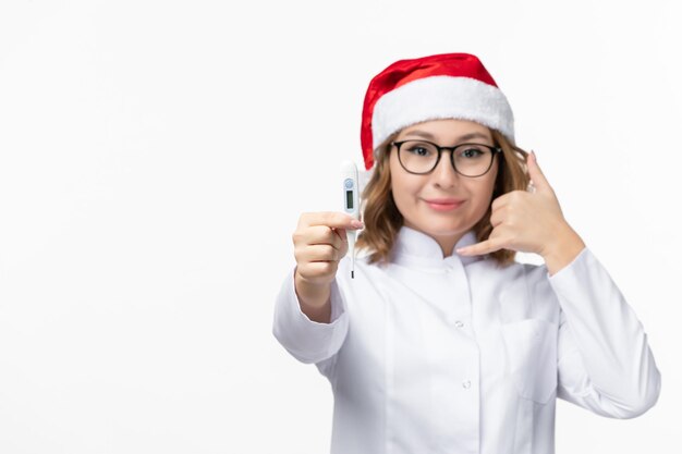 Close up on young pretty woman wearing Christmas hat isolated