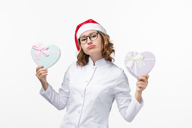 close up on young pretty woman wearing christmas hat isolated
