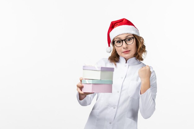 Close up on young pretty woman wearing Christmas hat isolated