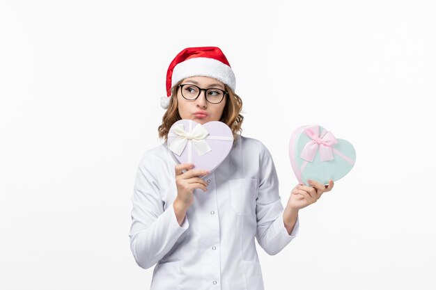 Close up on young pretty woman wearing Christmas hat isolated