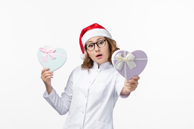 close up on young pretty woman wearing christmas hat isolated