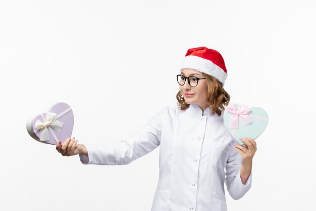 Close up on young pretty woman wearing Christmas hat isolated