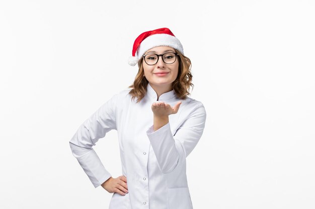 Close up on young pretty woman wearing Christmas hat isolated