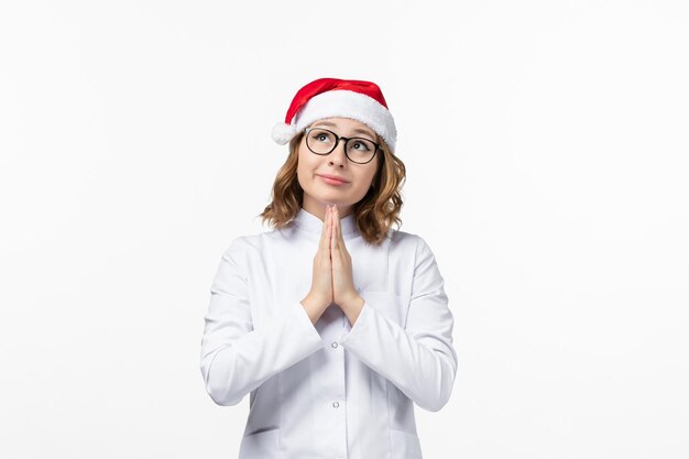 Close up on young pretty woman wearing Christmas hat isolated