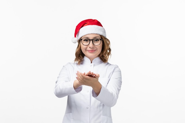 Close up on young pretty woman wearing Christmas hat isolated