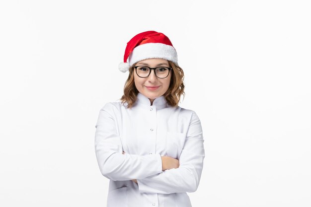 Close up on young pretty woman wearing Christmas hat isolated