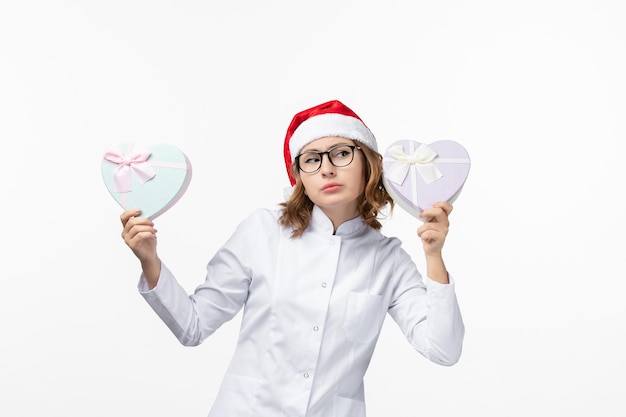 Close up on young pretty woman wearing Christmas hat isolated