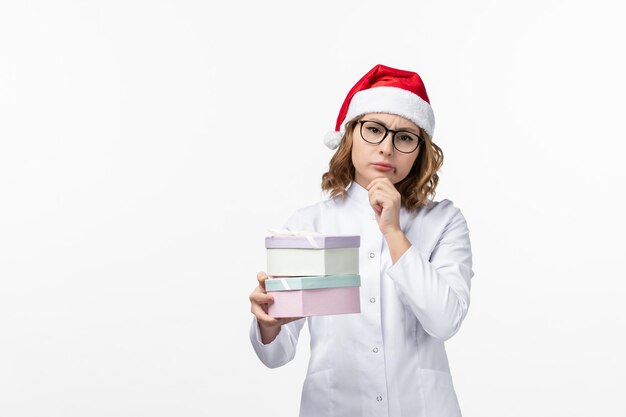 Close up on young pretty woman wearing Christmas hat isolated