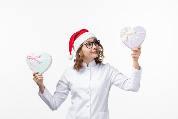 Close up on young pretty woman wearing Christmas hat isolated