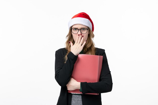 Close up on young pretty woman wearing Christmas hat isolated