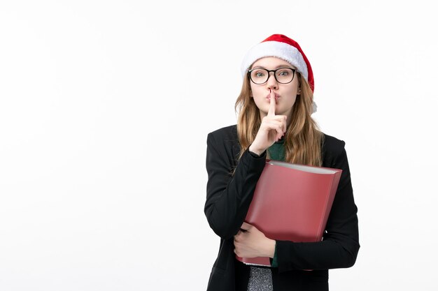 Close up on young pretty woman wearing Christmas hat isolated